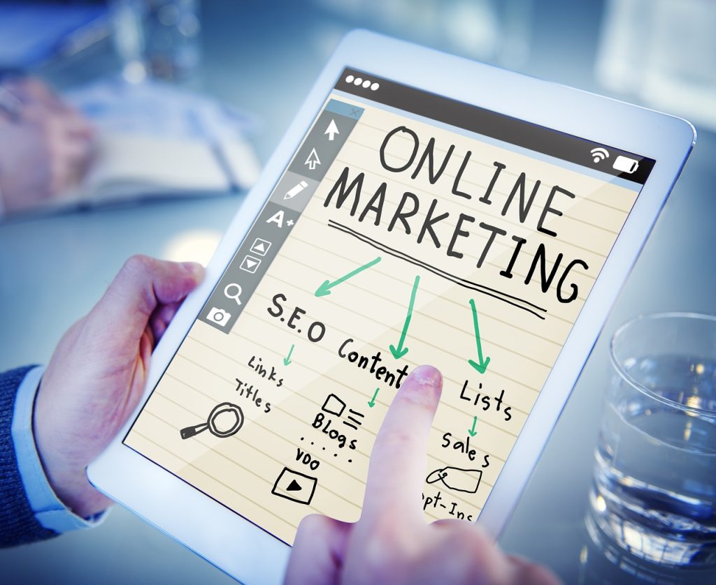 An image of a tablet showing picture of online marketing.