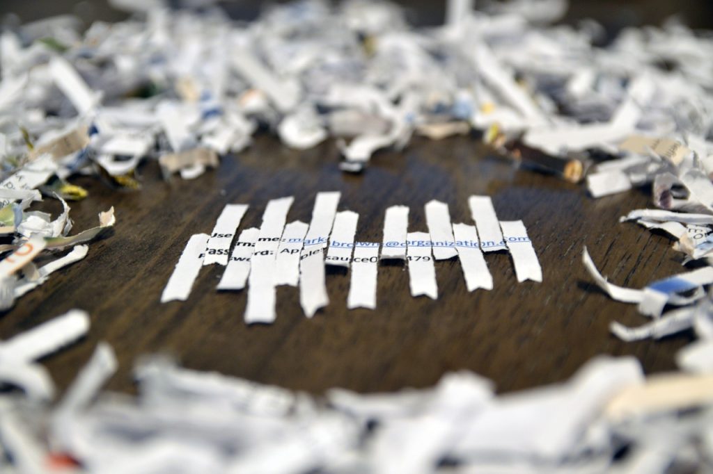 A picture of shredded information about a person being put back together. This is what happens with bad form security.