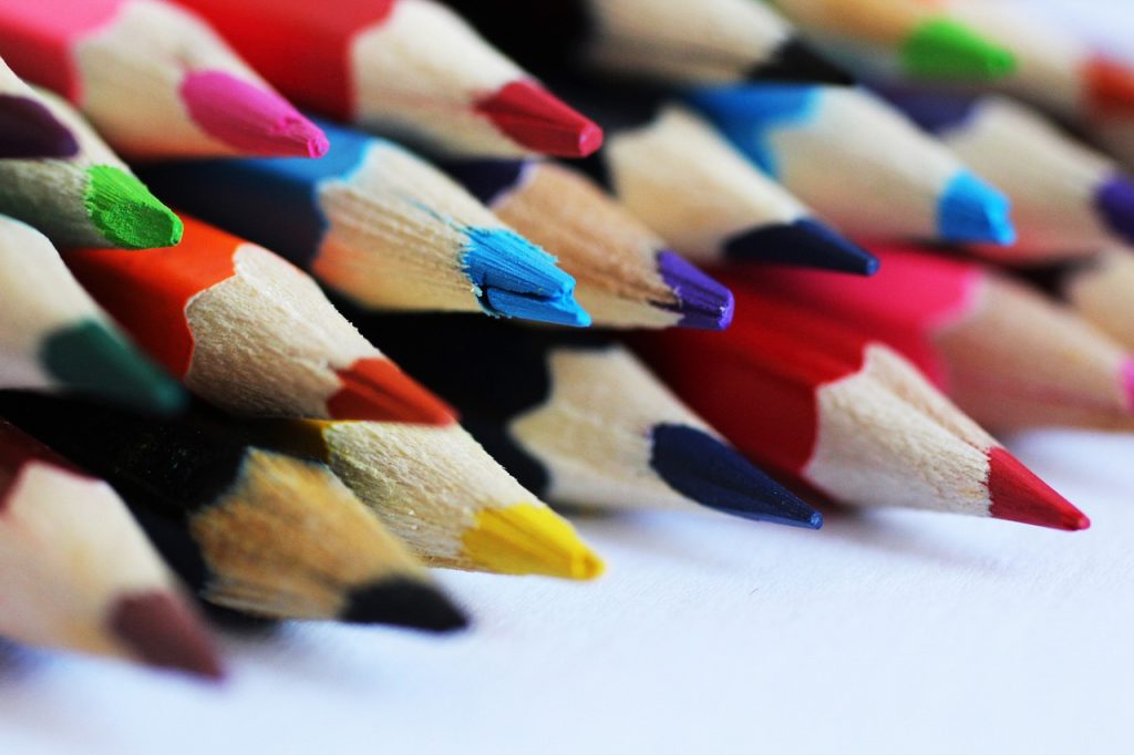 Colored pencils sitting on top of each other.