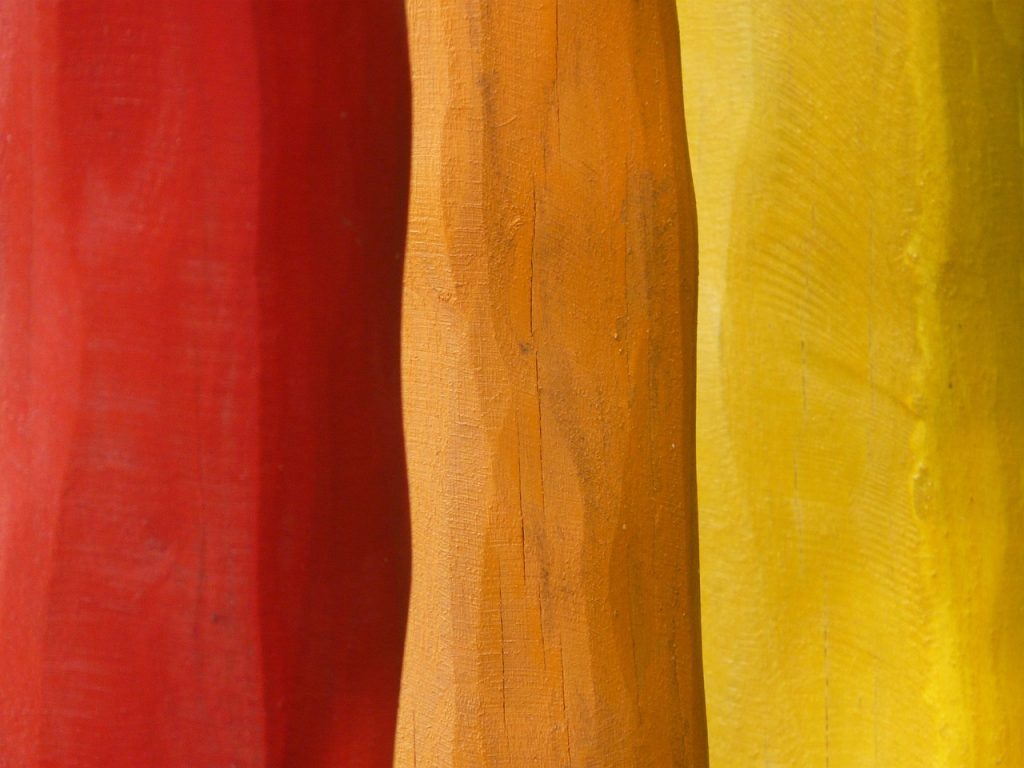 A picture of red, orange, and yellow wood.